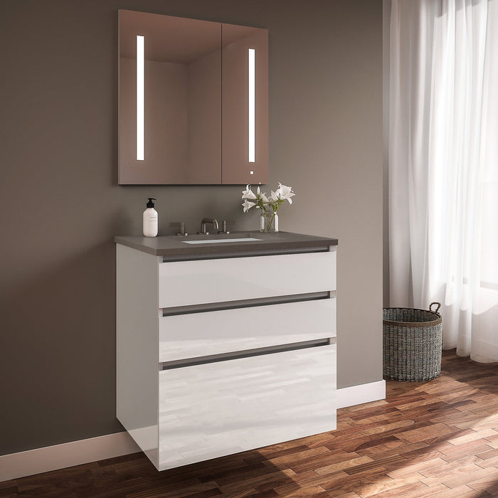 Curated Cartesian 24" x 7-1/2" x 21" and 24" x 15" x 21" three drawer vanity in white glass with tip out drawer, slow-close plumbing drawer, full drawer and Engineered Stone 25" vanity top in stone gray (Silestone expo grey)