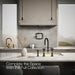 KOHLER K-28673-9 Billet Two-hole bridge kitchen sink faucet with side sprayer, matte black with brushed moderne brass -...